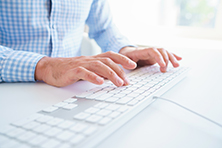 Male hands or men office worker typing on the keyboard